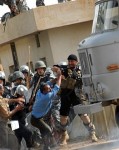 ALeqM5iCF-3kgYsUqrMeyYRJKHEUZukgzg A picture released by the People's Mujahedeen Iranian opposition group allegedly shows police beating protestors - AFP