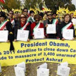 Demonstrators hold petitions asking President Obama to protect Iranians at Camp Ashraf in Iraq during a rally at the White House on Saturday. (Associated Press)